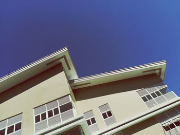 Low angle view of building against blue sky