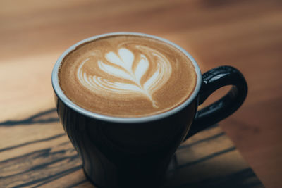 Close-up of cappuccino on table