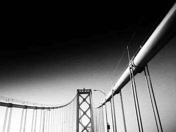 Low angle view of cables against sky