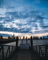 Scenic view of dramatic sky over cityscape