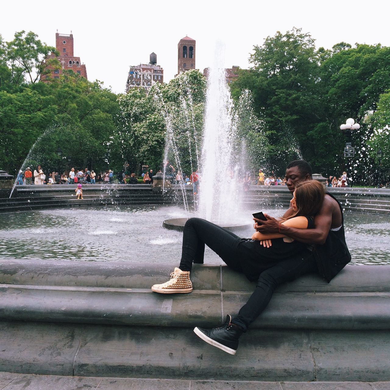 water, fountain, lifestyles, leisure activity, motion, tree, men, person, building exterior, built structure, architecture, splashing, spraying, full length, sitting, waterfall, long exposure, travel