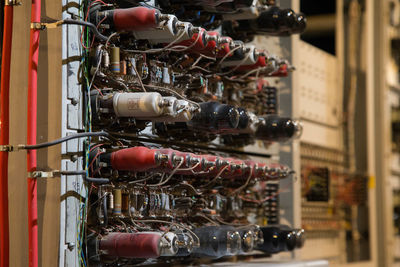 Close-up of wine bottles on display at store