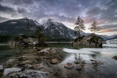 Scenic view of lake and mountains against sky