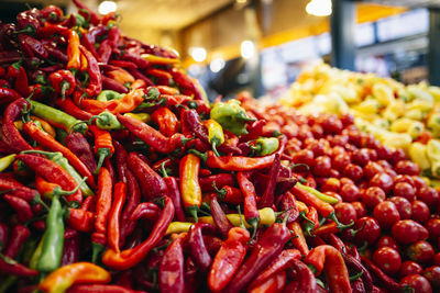 Red chili peppers for sale at market stall