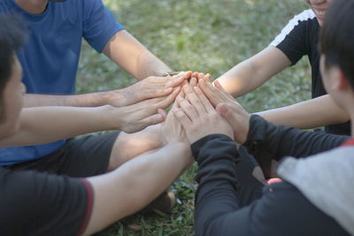 High angle view of people hands