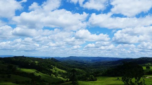 Scenic view of mountains against cloudy sky