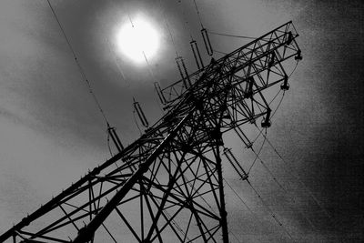 Low angle view of power lines against sky