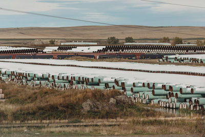 Scenic view of field against sky pipes industrial oil gas keystone pipeline