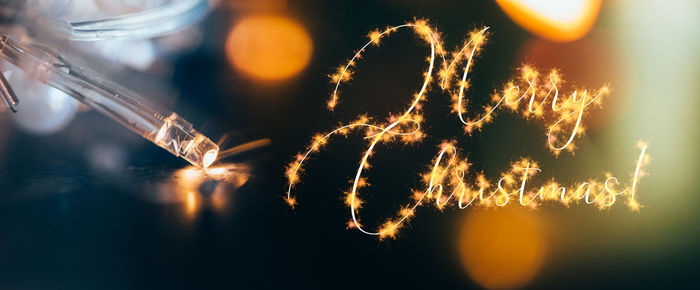 Close-up of illuminated christmas lights at night