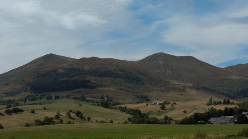 Scenic view of landscape and mountains against sky