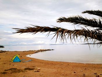 Scenic view of sea against cloudy sky