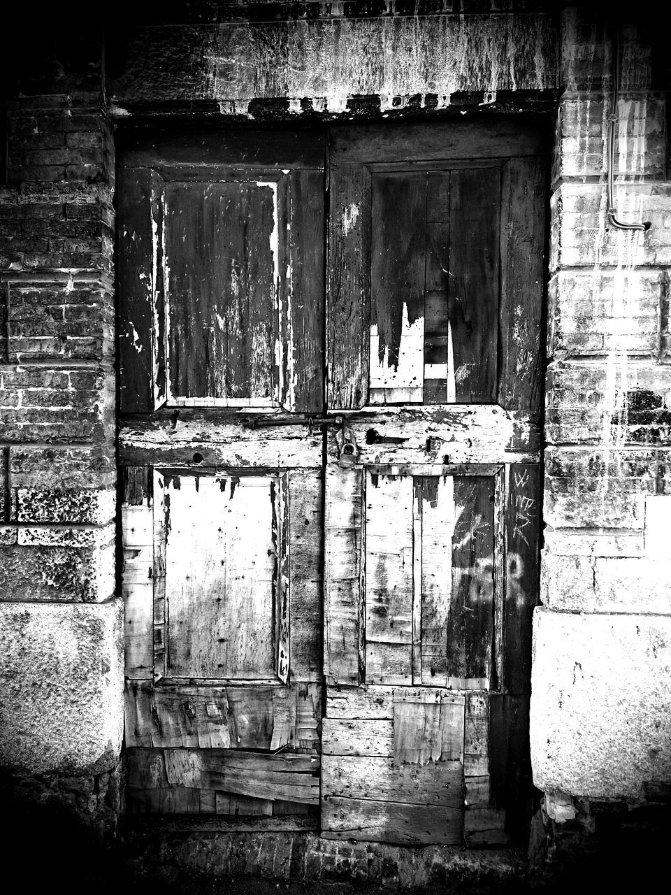 architecture, built structure, old, building exterior, abandoned, weathered, damaged, door, wall - building feature, obsolete, deterioration, run-down, closed, window, bad condition, house, wall, brick wall, wood - material, day