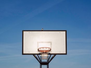 Low angle view of basketball hoop against wall