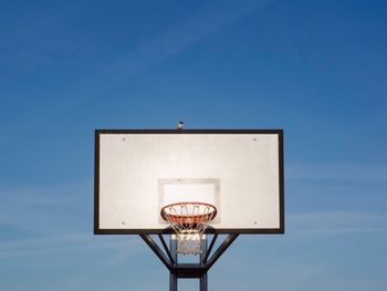 Low angle view of basketball hoop against wall