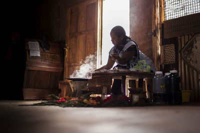 Low angle view of woman working at home