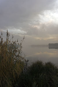 Scenic view of lake against sky during sunset