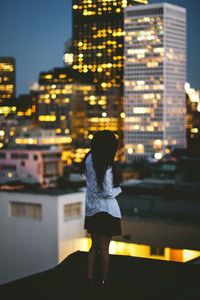 View of illuminated buildings in city at night