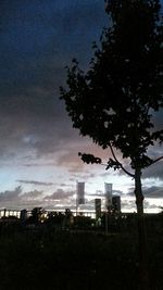 Built structures against sky at sunset