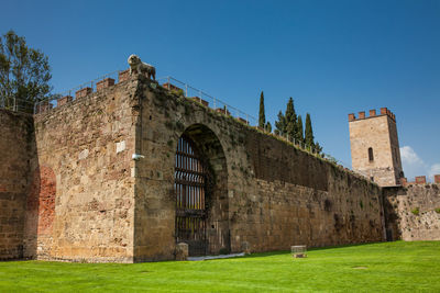 Gate of the lion and the saint mary tower at the ancient walls of pisa