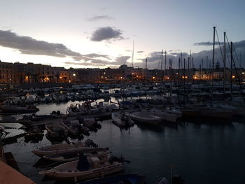 Boats moored at harbor