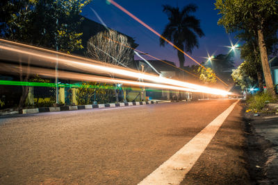 Light trails on street in city at night