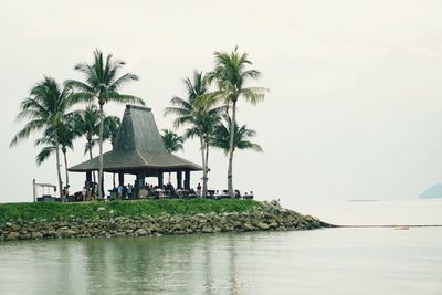 Built structure on beach against sky