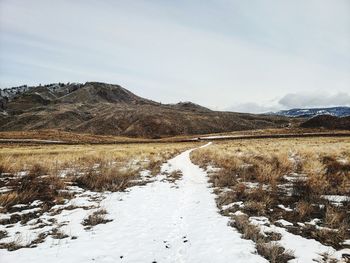 Scenic view of snowcapped mountains against sky