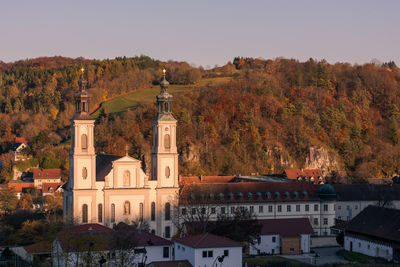 Buildings in town against sky