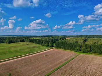 Scenic view of agricultural field against sky