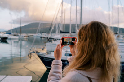 Side view of woman using mobile phone