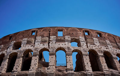 Low angle view of historical building against blue sky