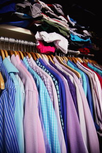 Close-up of shirts hanging in wardrobe