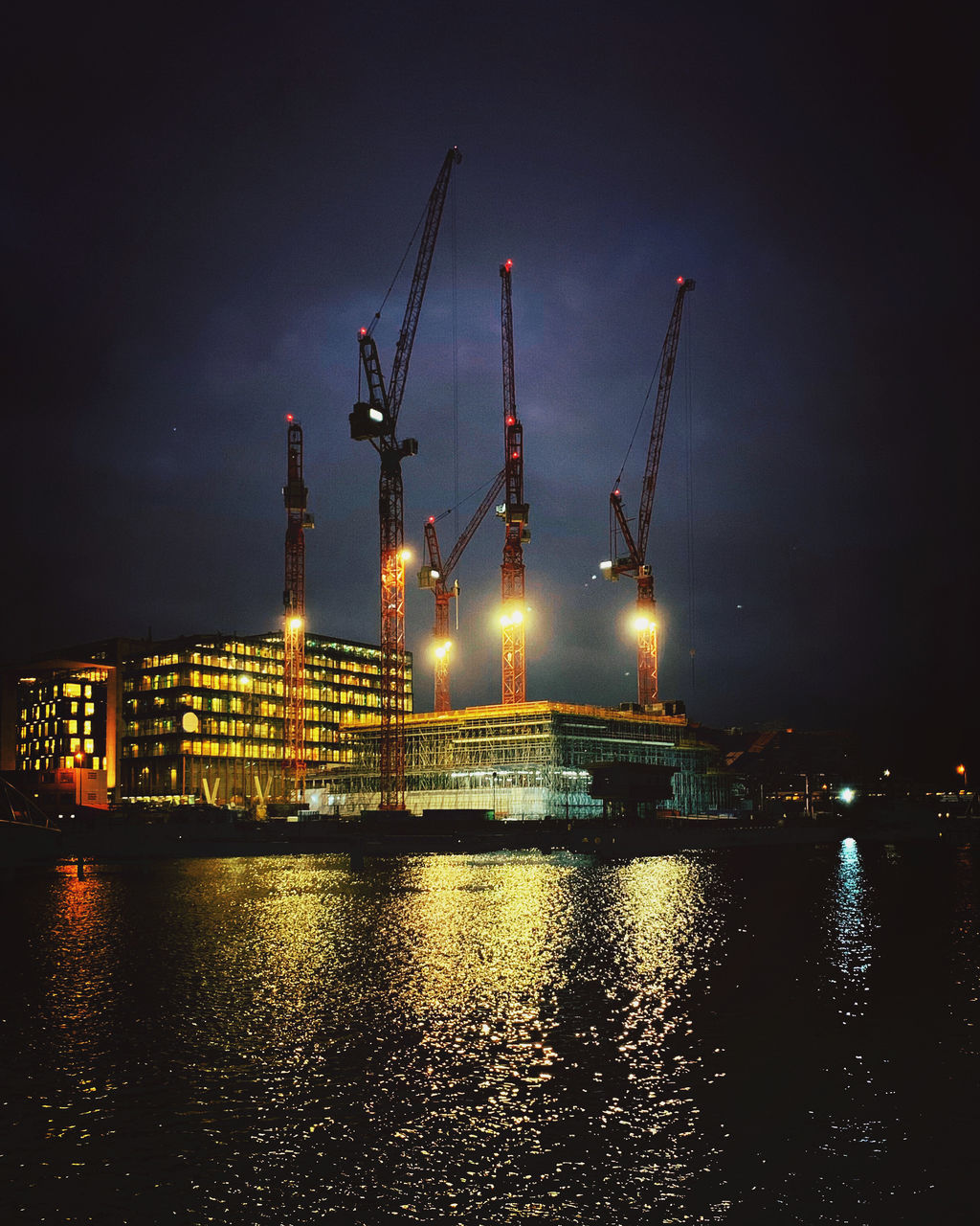 illuminated, water, night, industry, sky, waterfront, reflection, machinery, architecture, built structure, crane - construction machinery, nature, no people, river, building exterior, transportation, outdoors, cloud - sky, business, construction equipment