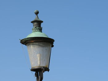 Low angle view of street light against sky