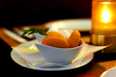 Close-up of orange fruits in plate