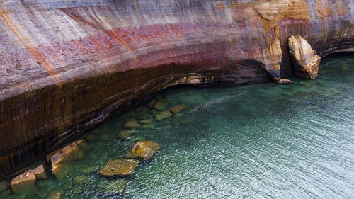 Scenic view of rock formation by lake