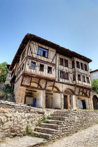 Low angle view of old building against clear sky