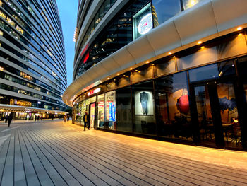 Illuminated modern buildings in city at night