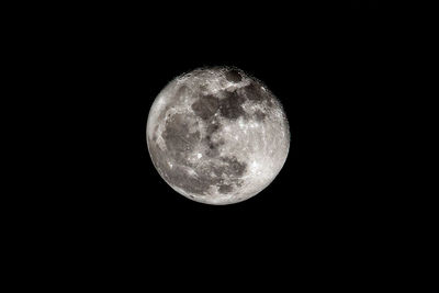 Low angle view of moon against sky at night