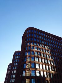 Low angle view of modern building against clear sky