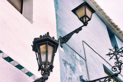 Low angle view of gas light against sky