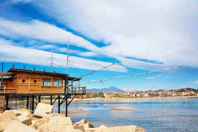 Trabucco al porto, overlooking the pescara seafront, with church and the gran sasso mountain