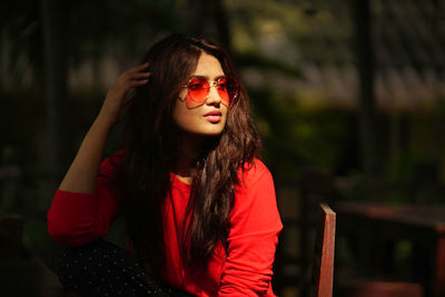 Portrait of young woman wearing sunglasses