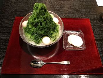 High angle view of vegetables in plate on table