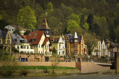 Houses in town against sky