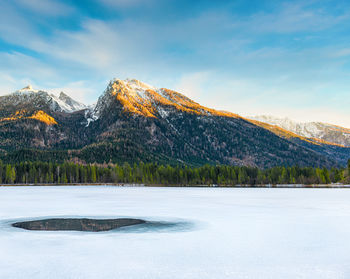 Scenic view of snowcapped mountains against sky