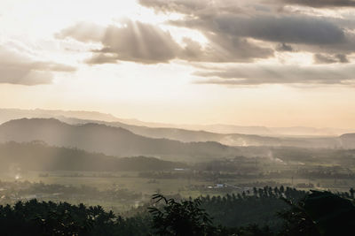 Scenic view of landscape against sky during sunset