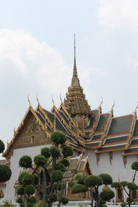 Low angle view of temple against building