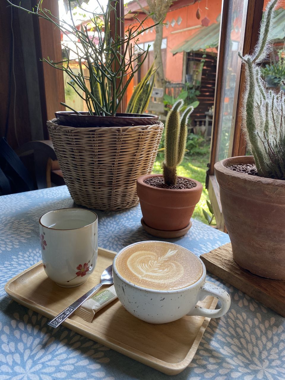 CLOSE-UP OF COFFEE CUP ON TABLE