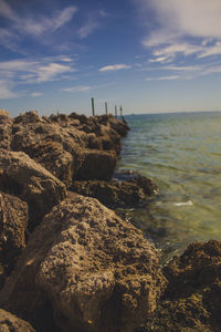 Scenic view of sea against cloudy sky